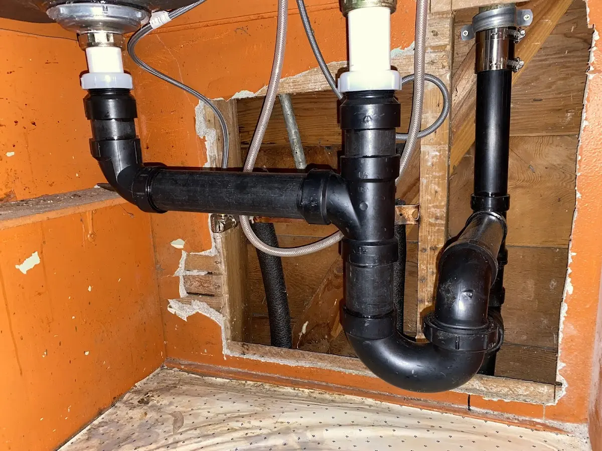 Professional Garbage Disposal Repair equipment and tools on the job in French Island